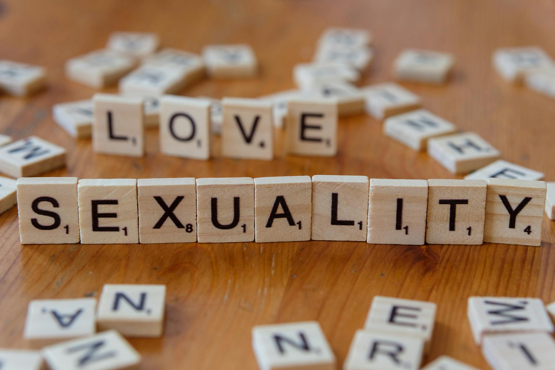 love and sexuality concept with letter tiles