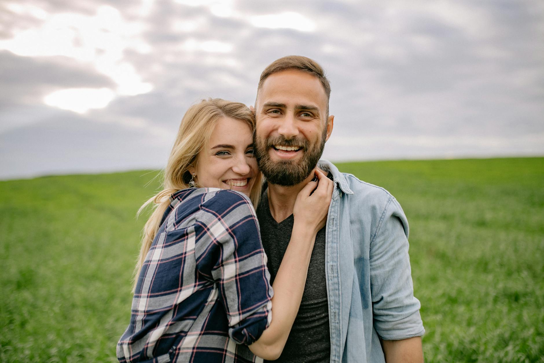 portrait of happy couple in grassland